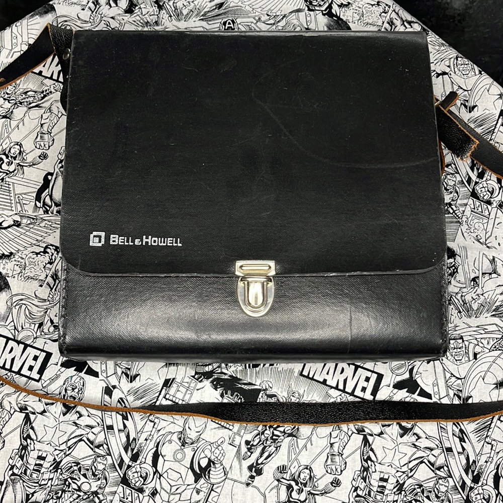 Vintage Bell & Howell camera bag with instructions